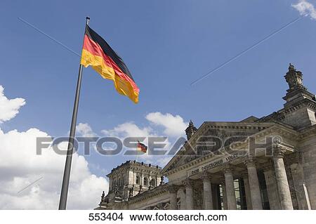 German flag fluttering in front of parliament building, The Reichstag, Berlin, Germany View Large Photo Image Picture - German flag fluttering in front of parliament building, The Reichstag, Berlin, Germany . Fotosearch