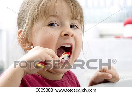 Girl brushing teeth View Large Photo Image Stock Image - Girl brushing teeth . Fotosearch