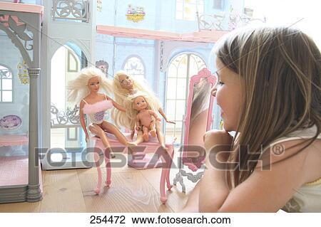 Girl playing with barbie doll View Large Photo Image Stock Image - Girl playing with barbie doll . Fotosearch