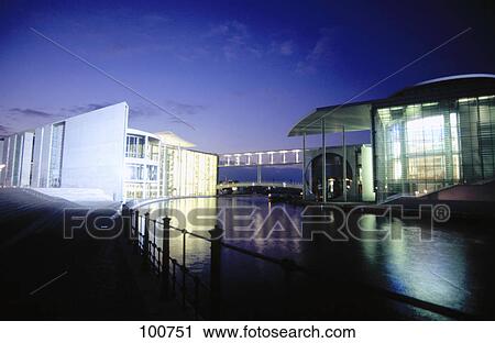 Stock Image - Government buildings lit up at night, Paul-Loebe-Haus, Marie-Elisabeth-Lueders-Haus, Spree River, Berlin, Germany . Fotosearch