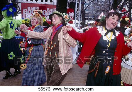Stock Image - Group of people dancing in carnival, Viktualienmarkt, Munich, Bavaria, Germany . Fotosearch
