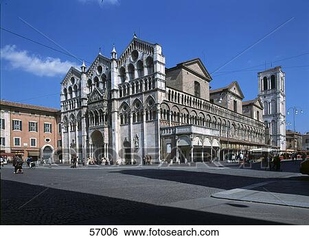 Stock Photograph - Group of people walking in front of church, Ferrara, Italy, Europe . Fotosearch
