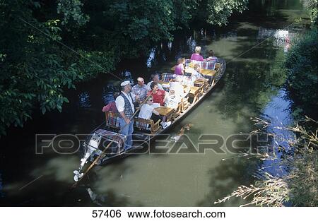 Group of tourists traveling in a tour boat, Lubbenau, Brandenburg, Germany View Large Photo Image Stock Photograph - Group of tourists traveling in a tour boat, Lubbenau, Brandenburg, Germany . Fotosearch