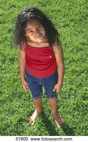 High angle view of a girl standing in a garden View Large Photo Image Stock Image - High angle view of a girl standing in a garden . Fotosearch