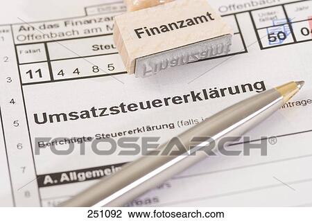 High angle view of ballpoint pen and rubber stamp on tax form  View Large Photo Image Stock Image - High angle view of ballpoint pen and rubber stamp on tax form . Fotosearch