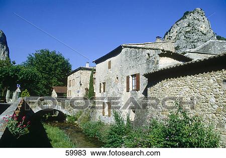 Stock Image - High angle view of bridge over dried river, Nyons, Drome, France, Europe . Fotosearch