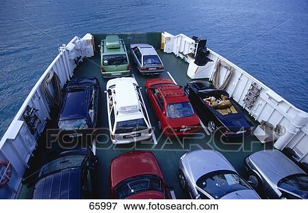 Stock Photo - High angle view of cars on ship in sea . Fotosearch