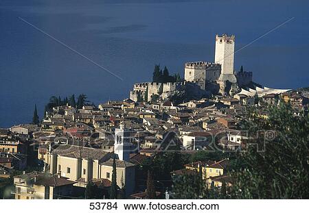 Picture - High angle view of castle in town, Malcesine Province, Italy . Fotosearch