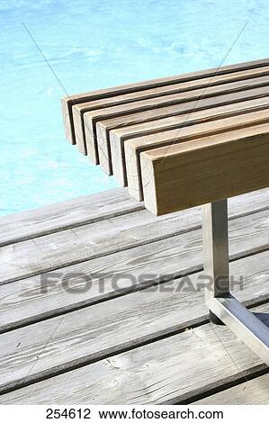 High angle view of empty bench at edge of swimming pool View Large Photo Image Stock Image - High angle view of empty bench at edge of swimming pool . Fotosearch