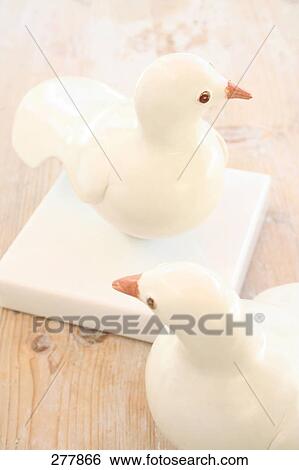 Stock Photograph - High angle view of figurines of doves . Fotosearch