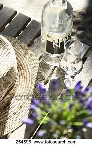 High angle view of glass and bottle of white wine View Large Photo Image Stock Photograph - High angle view of glass and bottle of white wine . Fotosearch
