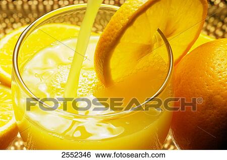 High angle view of glass of orange juice and drinking straw View Large Photo Image Stock Photograph - High angle view of glass of orange juice and drinking straw . Fotosearch