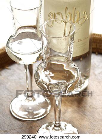 High angle view of glasses of white wine View Large Photo Image Stock Image - High angle view of glasses of white wine . Fotosearch