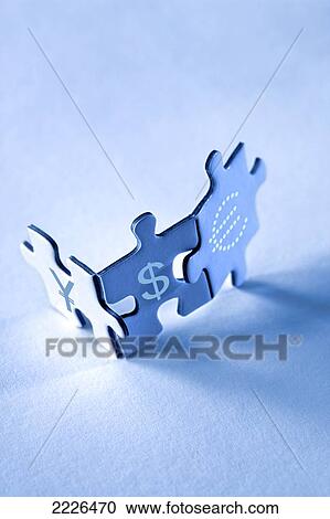 Stock Image - High angle view of jigsaw pieces . Fotosearch