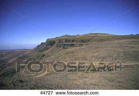 Stock Photo - High angle view of mountain road, Sani Pass, Drakensberg, KwaZulu-Natal, South Africa . Fotosearch