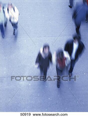 Stock Photo - High angle view of people walking . Fotosearch
