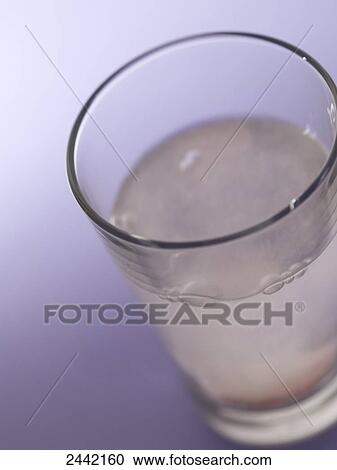 High angle view of pill dissolved in glass of water View Large Photo Image Stock Image - High angle view of pill dissolved in glass of water . Fotosearch