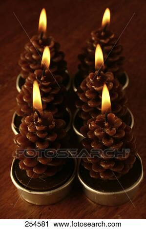 High angle view of pine cones shape lit candles View Large Photo Image Stock Image - High angle view of pine cones shape lit candles . Fotosearch