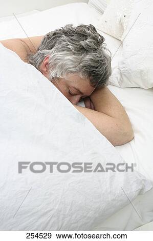 High angle view of senior woman sleeping in bed View Large Photo Image Stock Photo - High angle view of senior woman sleeping in bed . Fotosearch
