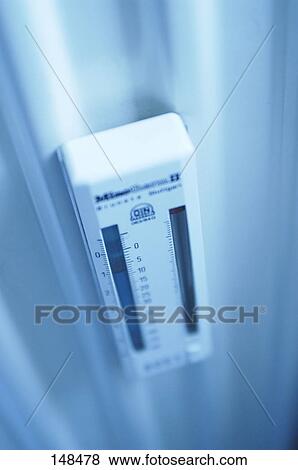 High angle view of thermometer on wall View Large Photo Image Stock Photo - High angle view of thermometer on wall . Fotosearch