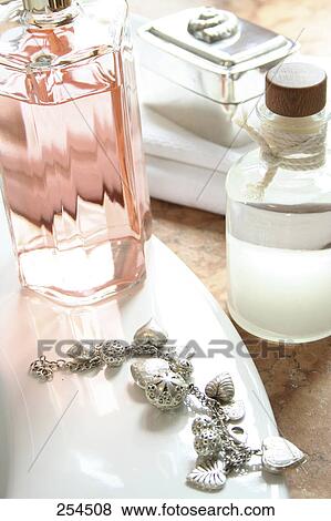 Stock Photo - High angle view of toiletries at washbasin . Fotosearch