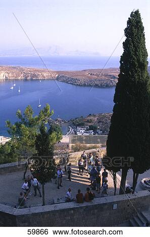 Stock Photograph - High angle view of tourist at observation point, Rhodes, Dodecanese Islands, Greece . Fotosearch