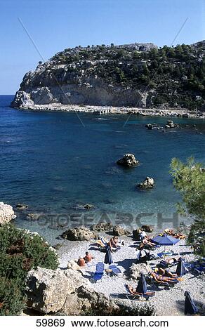 High angle view of tourists on beach, Rhodes, Dodecanese Islands, Greece View Large Photo Image Stock Photo - High angle view of tourists on beach, Rhodes, Dodecanese Islands, Greece . Fotosearch