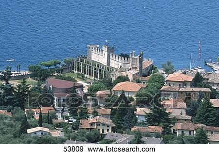 High angle view of town at coast, Torri del Benaco, Lake Garda, Italy View Large Photo Image Stock Photo - High angle view of town at coast, Torri del Benaco, Lake Garda, Italy . Fotosearch