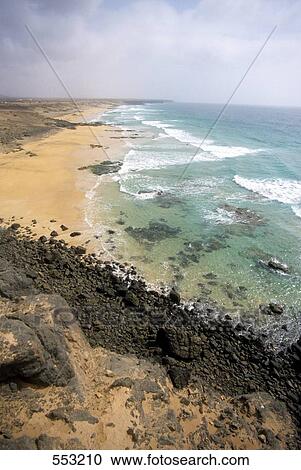 High angle view of waves on beach, Fuertoventura, Canary Islands, Spain View Large Photo Image Stock Image - High angle view of waves on beach, Fuertoventura, Canary Islands, Spain . Fotosearch