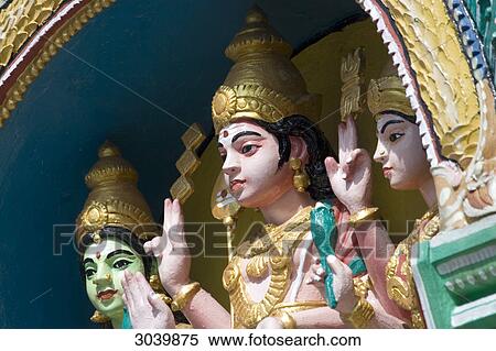 Stock Photography - Hindu temple in Tanah Rata in the Cameron Highlands, Malaysia showing god Murugan with his wives . Fotosearch