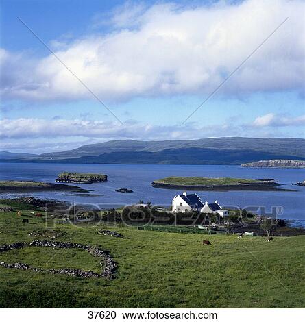 Stock Image - Houses at coast, Duirinish Peninsula, Isle of Skye, Scotland . Fotosearch