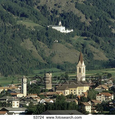 Picture - Houses in town with convent in background, Marienberg Abbey, Vinschgau, Alto Adige, Italy . Fotosearch