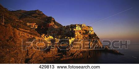 Stock Image - Houses on cliff, Manarola, Cinque Terre, Liguria, Italy . Fotosearch