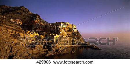 Stock Photograph - Houses on cliff, Manarola, Cinque Terre, Liguria, Italy . Fotosearch