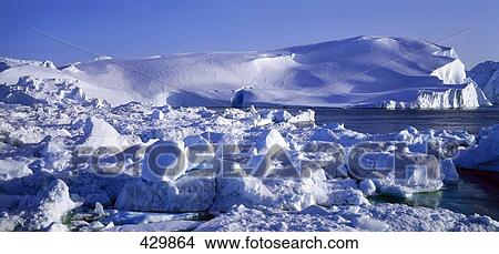 Picture - Icebergs floating on water in fjord . Fotosearch