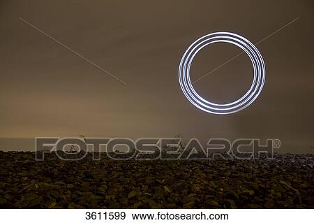 Illuminated circle at sky, Oberhausen, North Rhine-Westphalia, Germany, Europe View Large Photo Image Stock Photo - Illuminated circle at sky, Oberhausen, North Rhine-Westphalia, Germany, Europe . Fotosearch
