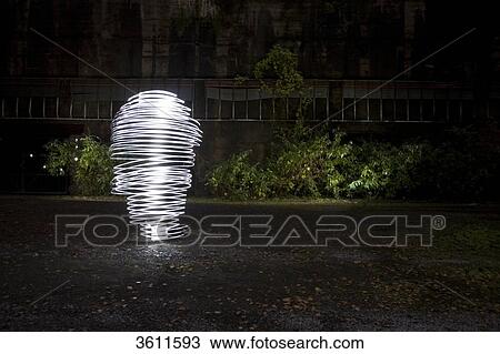 Stock Image - Illuminated spiral, Oberhausen, North Rhine-Westphalia, Germany, Europe . Fotosearch