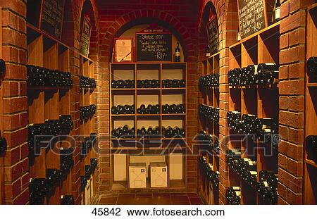 Stock Image - Interiors of wine cellar, Neethlingshof Winery, Western Cape Province, South Africa . Fotosearch