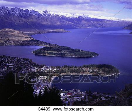 Stock Photo - Island in lake, Lake Wakatipu, Queenstown, Otago, New Zealand . Fotosearch