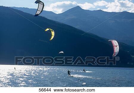 Kite surfers in lake, Lake Reschensee, Vinschgau, South Tyrol, Italy View Large Photo Image Picture - Kite surfers in lake, Lake Reschensee, Vinschgau, South Tyrol, Italy . Fotosearch