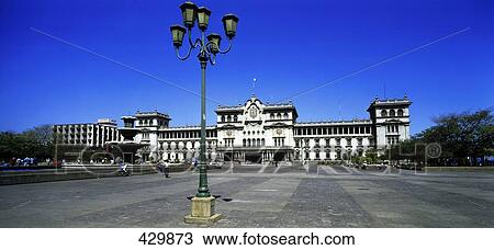 Stock Image - Lamppost with palace in city, National Palace, Guatemala . Fotosearch