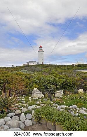 Stock Image - Lighthouse at the Danger Point, Agulhas National Park, Republic of South Africa . Fotosearch