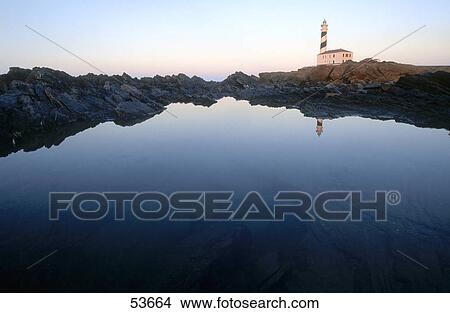 Picture - Lighthouse on coast, Cap de Favaritx, Minorca, Balearic Islands, Spain . Fotosearch