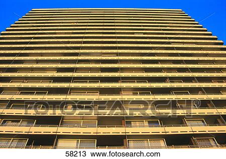 Stock Image - Low angle view of multistoried building . Fotosearch