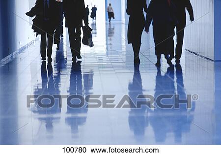 Low section view of businesspeople walking in corridor View Large Photo Image Stock Image - Low section view of businesspeople walking in corridor . Fotosearch