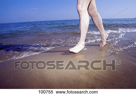 Low section view of man running on beach View Large Photo Image Stock Photography - Low section view of man running on beach . Fotosearch