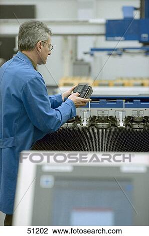 Male mechanic repairing digital camera View Large Photo Image Stock Image - Male mechanic repairing digital camera . Fotosearch