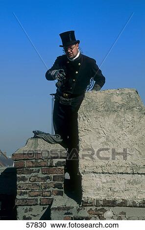 Man cleaning chimney View Large Photo Image Stock Image - Man cleaning chimney . Fotosearch