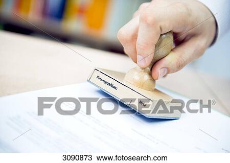 Man stamping papers, close-up View Large Photo Image Stock Image - Man stamping papers, close-up . Fotosearch