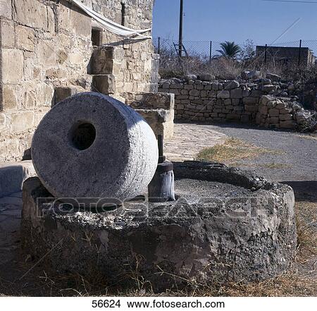 Millstone for olives, Kouklia, Phaphos, Cyprus View Large Photo Image Picture - Millstone for olives, Kouklia, Phaphos, Cyprus . Fotosearch